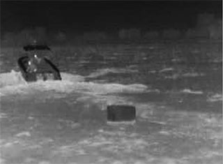 FLIR thermal image of a boat dropping contraband